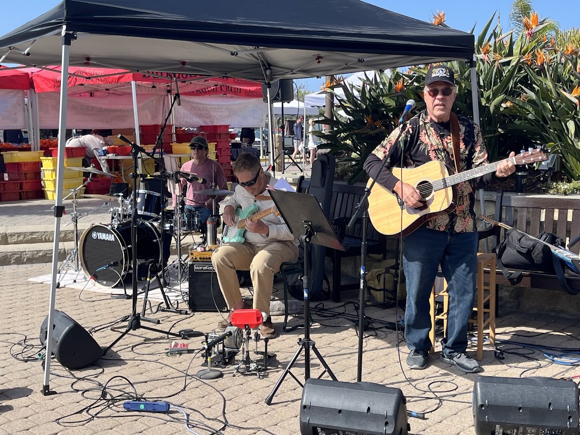A hat of the avatar from the video game "Boundless" sits on top of a speaker, as if in a performance or performance's afte...